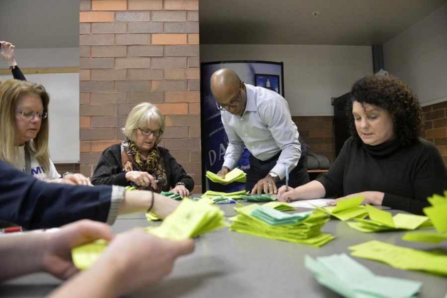 Staff members count ballots at a caucus site in Des Moines, Iowa, on Monday, Feb. 1. (Yin Bogu/Xinhua/Sipa USA/TNS)