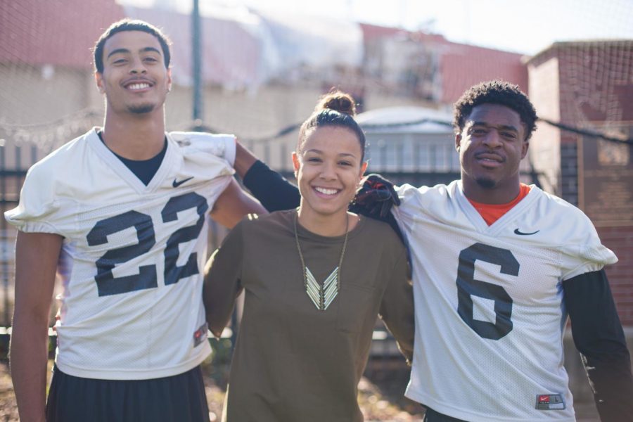 Wide receivers Seth Collins (left), Victor Bolden (right) and Seth's sister Devin Collins (center) remain close , despite the fact that Bolden and Devin are dating.