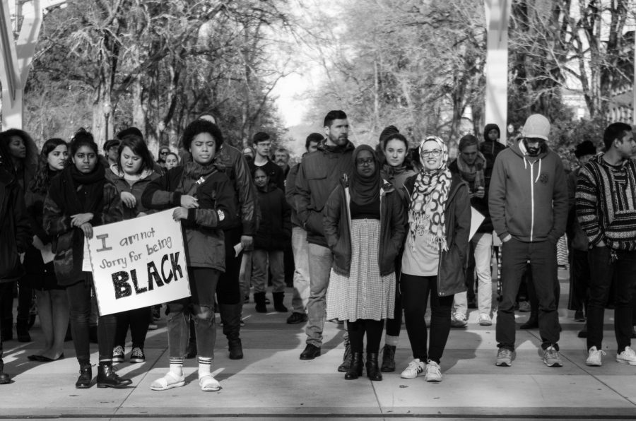 Members of the OSU community stand and listen to the closing remarks from MLK Jr. celebration peace march.