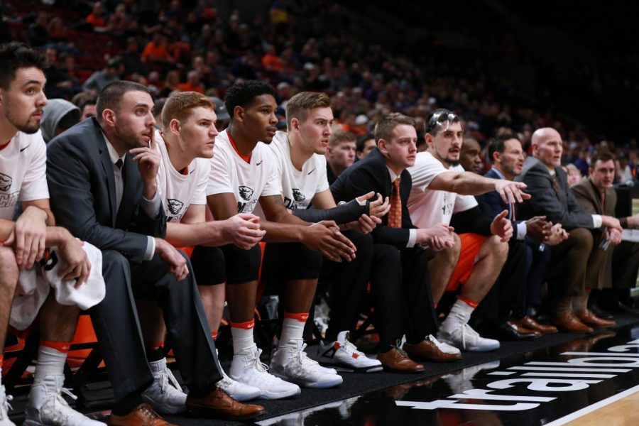 Tres Tinkle (CENTER) holds his injured wrist during the game against University of Portland. Tinkle looks to return to play. 