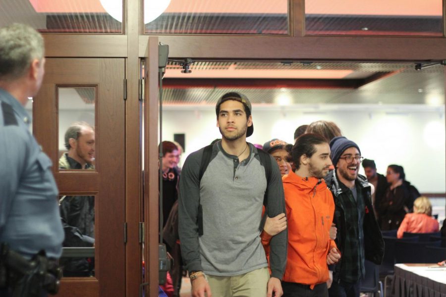 After the meeting was adjourned without a decision, protesters followed the board members out of the Memorial Union and down Jefferson Avenue toward Kerr Administration Building.