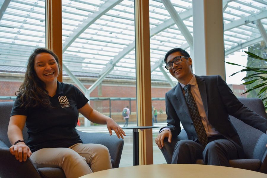 Baum (left) and Trinidad (right) laugh while sitting inside of the Student Experience Center. As CRFs, they host workshops and events inside residence halls to create discussion. 