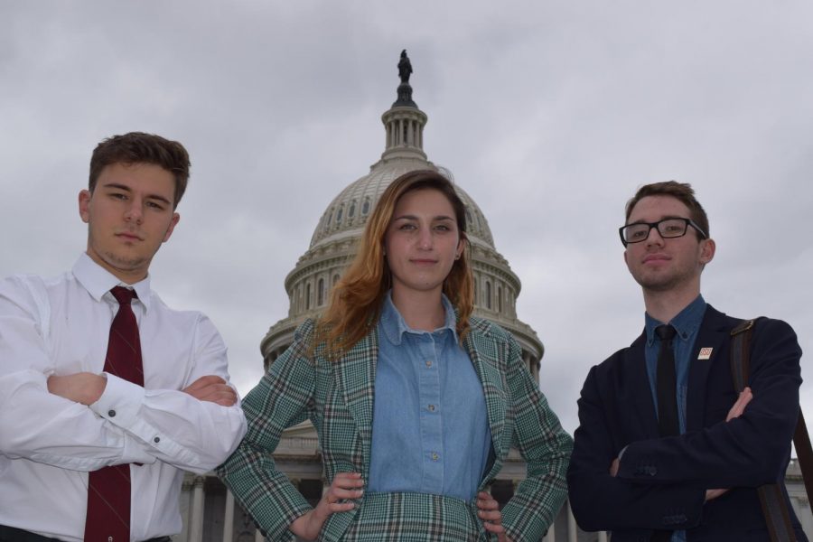 Ryan Khalife, Jacqueline Logsdon and Luke Bennett stand in front of the Capitol Building.