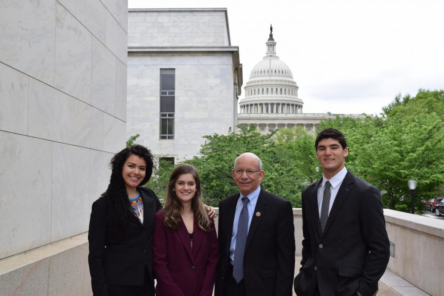 Anesta León Guerrero, Josey Koehn, Rep. Peter DaFazio and David Lax pose with the Capitol Building in the background.