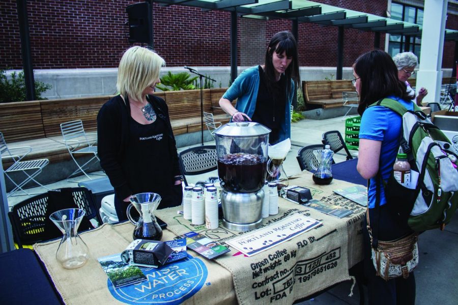 Tamara Wilson (left) and Michelle Singer-Nielsen (right) manage the Portland Roasting Coffee booth. The second annual Food Fair allowed students and community members to sample and take food from several vendors. 