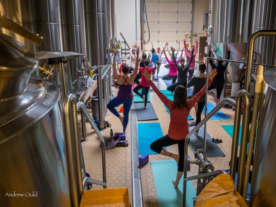 Beer+yoga+participants+stand+in+the+tree+pose+in+the+Mazama+Brewing+taproom.