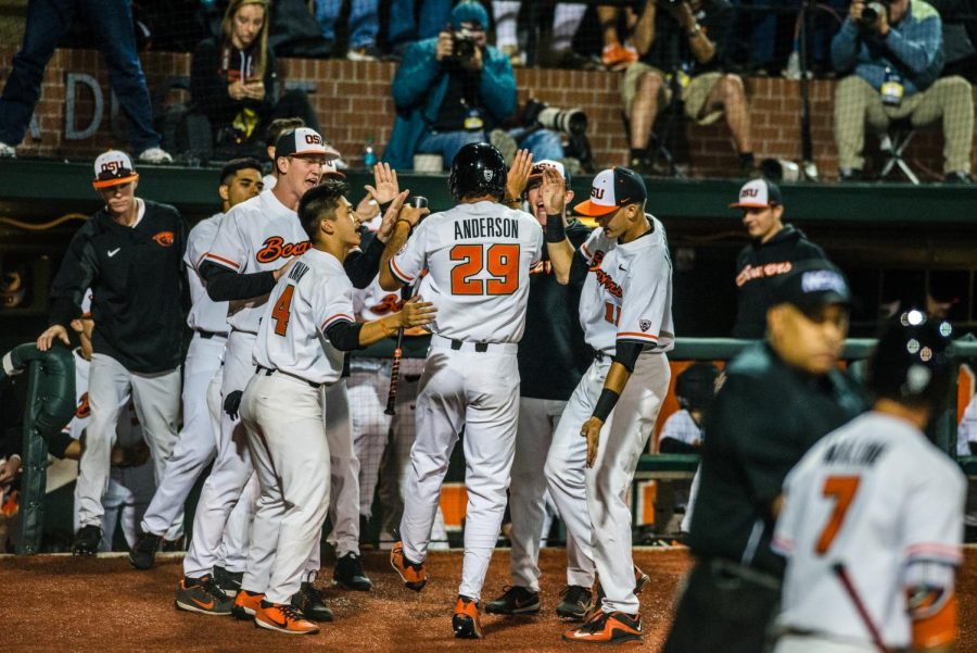 The Beavers celebrate after winning the Corvallis regional, bringing their record to 52-4. 