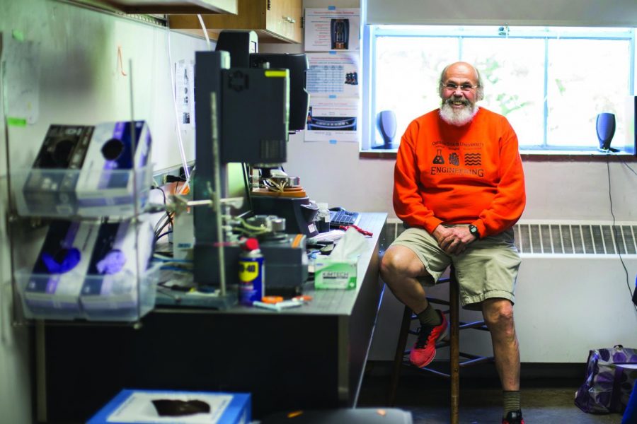 Oregon State Associate Professor Skip Rochefort sitting on a stool in his laboratory. Professor Rochefort is helping to develop a more inclusive environment in undergraduate research at Oregon State. 