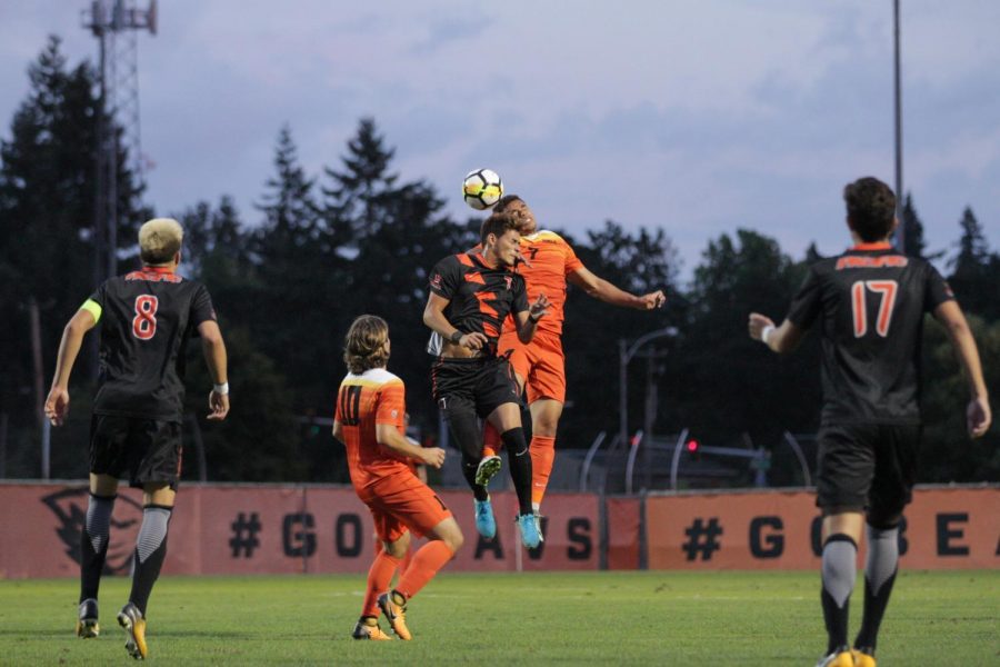 Midfielder Hassani Dotson competes for a header while Jaime Miralles looks on. The Beavers their final non-conference game of the season by a score of 2-0. They will face Washington next weekend to open Pac-12 play.