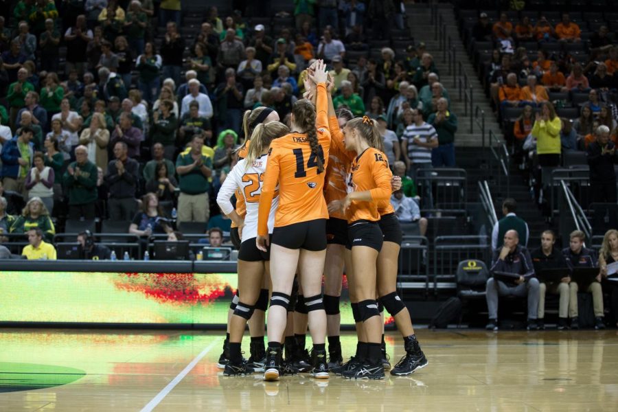 The OSU volleyball team in a pre-game huddle in an earlier match up against rival University of Oregon. OSU has won their past four conference match ups. 