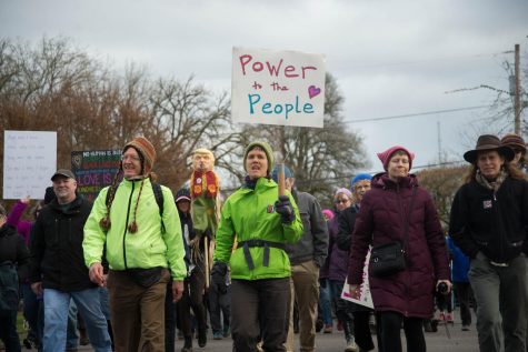 Demonstrators walking through downtown Corvallis as part of the 2018 Womens March. 