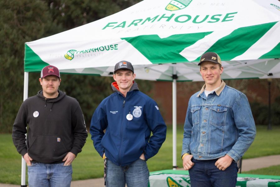 (Left to right) Eston Hughey, Raymond Seal and Seth Barnhart stand in front of the Farmhouse Fraternity tent in the Memorial Union Quad. Farmhouse is returning after 22 years.