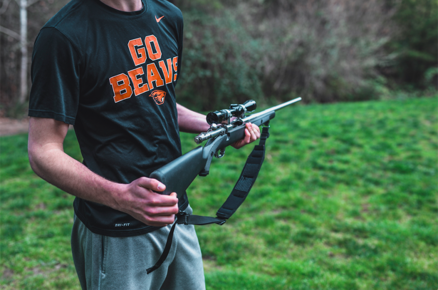 Robert Lohman, second year student studying business, holds his family’s firearm, which is kept at his family’s home. Oregon State University restricts firearms on university property.