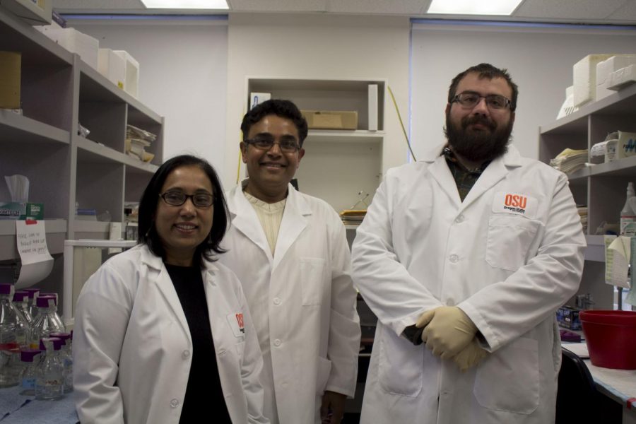 (Left to right) Gitlali Indra, Arup Indra and Evan Carpenter stand in the Indra Lab located inside the Pharmacy building.