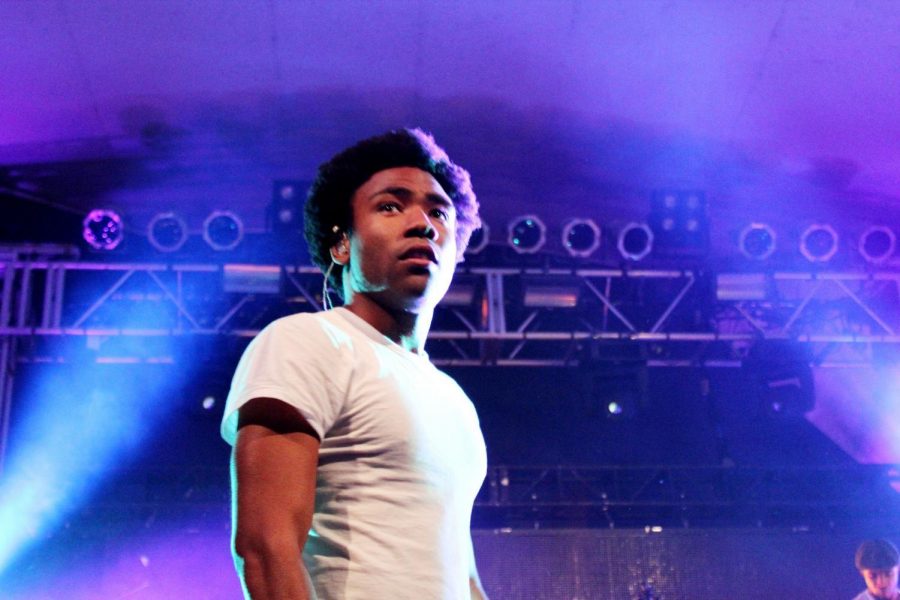 Donald Glover, otherwise known as Childish Gambino, looks into the crowd while on stage. Childish Gambinos This is America became the No. 1 song on the Billboard Hot 100 chart Monday.