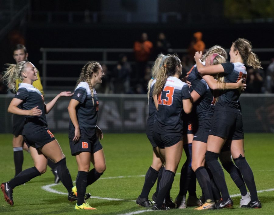 (LEFT TO RIGHT) OSUs Ashleigh Fonsen, Toni Malone, McKenzie Weinert and Allison Pantuso surround Sydney Studer in celebration after her goal late in the game.