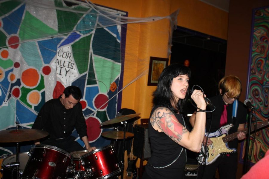 (L to R) Wes Walker, Caitlin Garets, and Indiana Laub perform as AFI at the 2016 Corvallis DIY Halloween Cover show. Garets and Laub will be returning to cover The Misfits this year. 