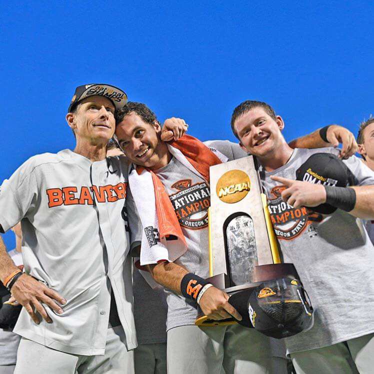 Former OSU outfielder Jack Anderson (MIDDLE) celebrates with then Beaver Baseball Head Coach Pat Casey (LEFT) and former outfielder Kyle Nobach (RIGHT) after the team won the 2018 NCAA College World Series Finals. After helping Oregon State Baseball win their third national championship, Anderson now attends Regis University, studying physical therapy. 
