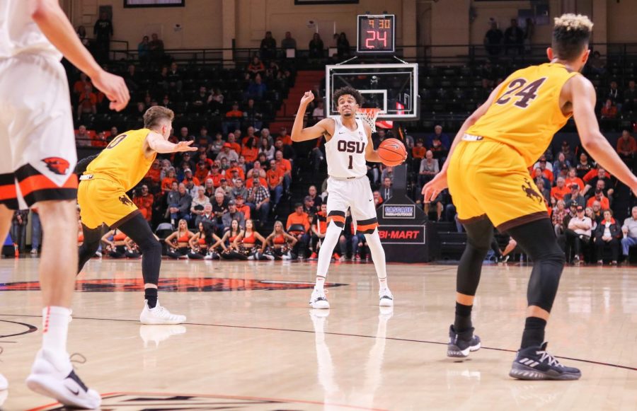 Senior point guard Stephen Thompson Jr. dribbles up court and calls for an offensive set up from his teammates. Thompson Jr. ended the night with 16 points, four assists and two steals to help the Beavers advance to 2-0 overall.  
