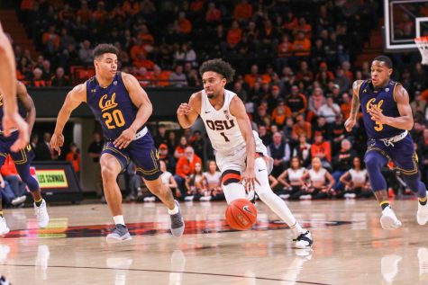 OSU senior guard Stephen Thompson Jr. (MIDDLE) leads his team in a fast break against California forward Matt Bradley (LEFT). Thompson Jr. scored 21 points to help the Beavers secure the 79-71 victory, as well as two assists and two steals.