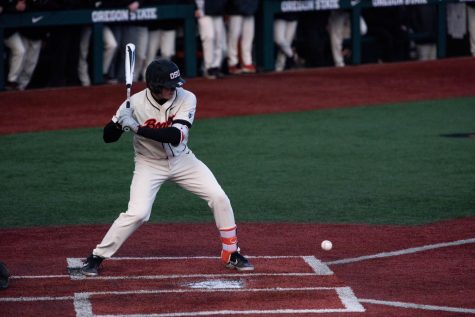 OSU junior catcher and infielder Adley Rutschman looks a low pitch past the home plate against Oregon.