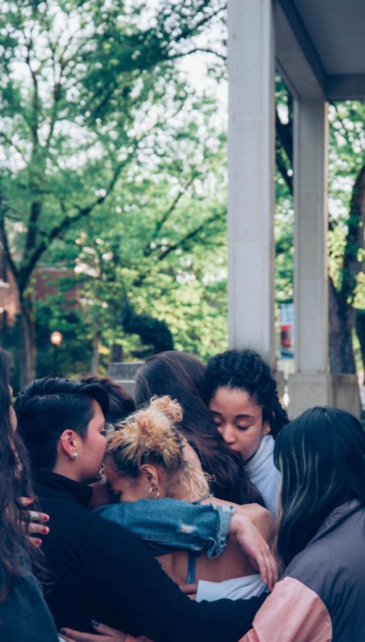 Members of Dam Diverse Dance, known as 3D, stand in a circle hugging. According to Isadora Costa Cardoso, creator and director of 3D, the group hug was prompted by a feeling of intimidation before and during their silent protest due to the presence of armed officers, who they felt were watching them. Clarification: In the April 29, 2019 issue of The Daily Barometer, this photo was used. The caption has been updated online to reflect the true context of the photo. 