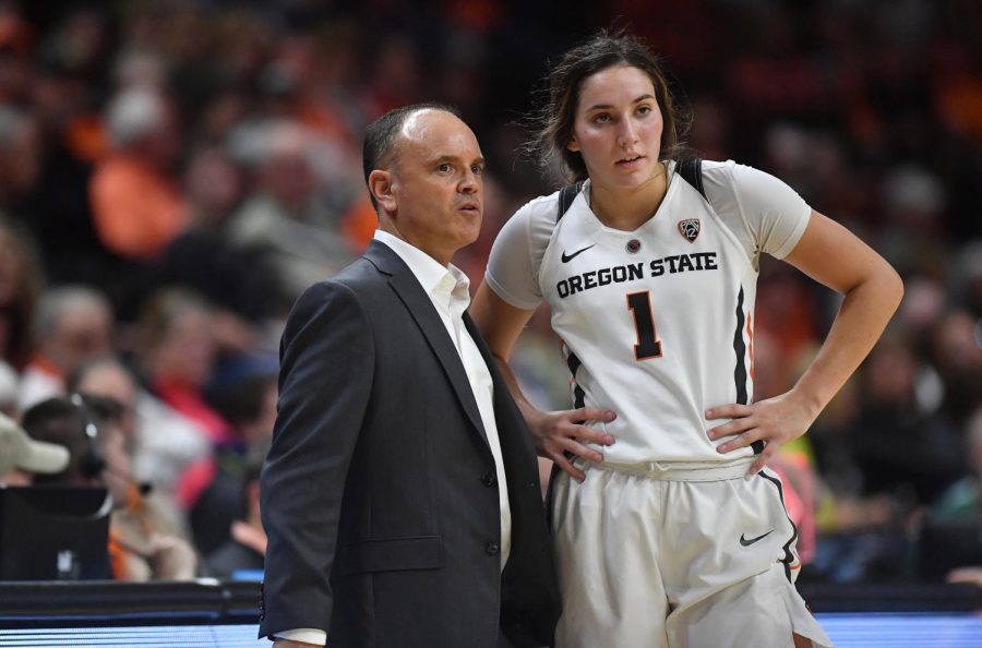 OSU Women’s Basketball head coach Rueck works with sophomore guard Aleah Goodman versus Cal Poly in Gill Coliseum on Sept. 9, 2018. 
