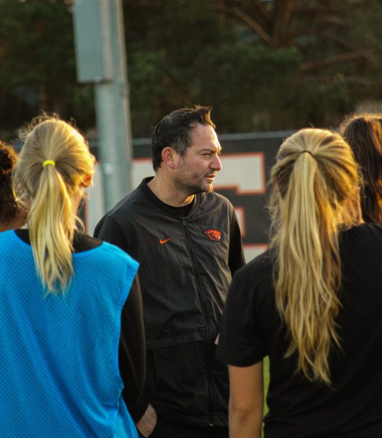 Kagan chats with players in an early morning practice Friday morning, Sept. 27. 