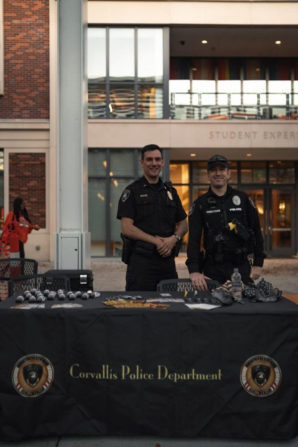 Two police officers represent the Corvallis Police Department at the Safety Fair in October. 
