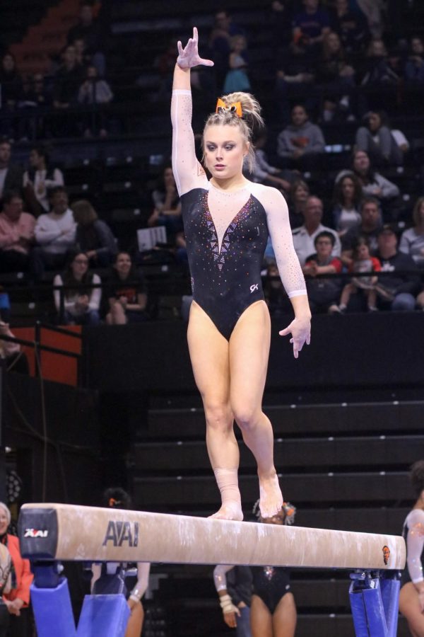 An OSU gymnast competes on the balance beam in Gill Coliseum. 