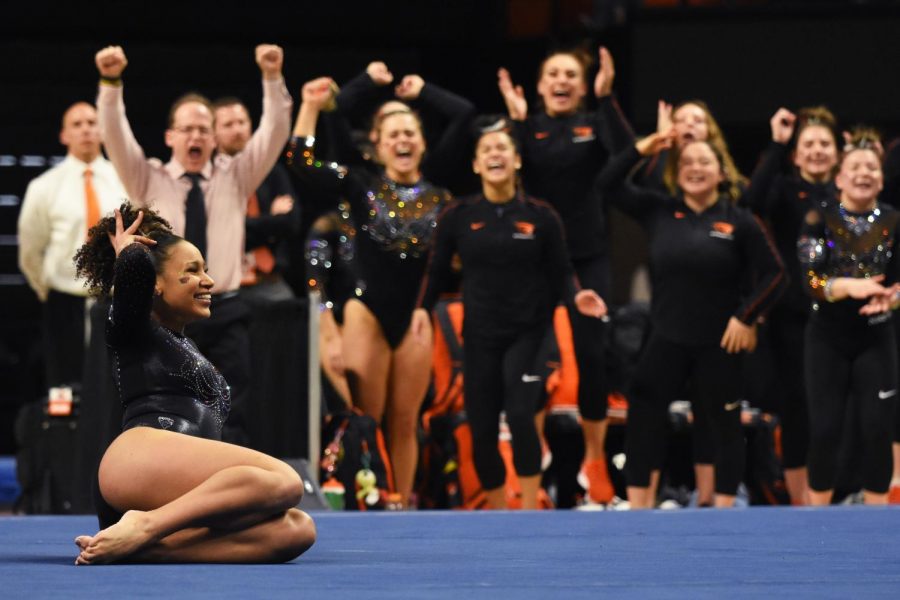 OSU+senior+Isis+Lowery+finishes+her+dance-filled%2C+one-of-a-kind+floor+routine%2C+while+her+teammates+and+coach+celebrate+at+the+edge+of+the+floor+on+Friday%2C+March+6.