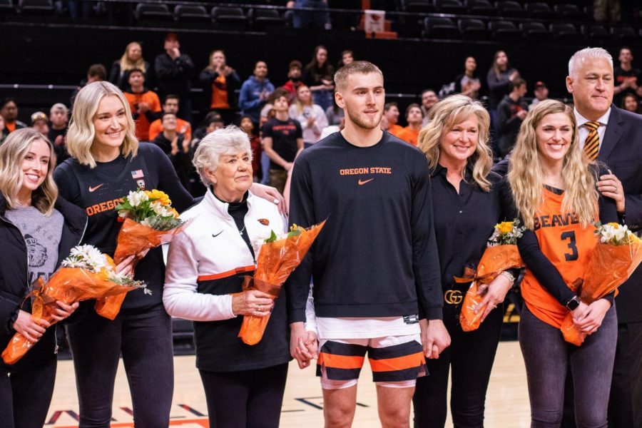 OSU senior forward Tres Tinkle smiles along with his family for senior night celebrations on March 7.