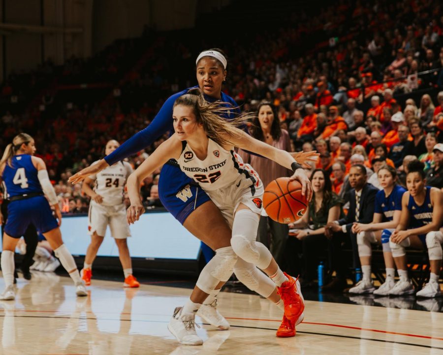 OSU senior guard Kat Tudor drives past a Washington defender towards the basket in her first of two games for senior weekend on Feb. 28, 2020 in Gill Coliseum. 