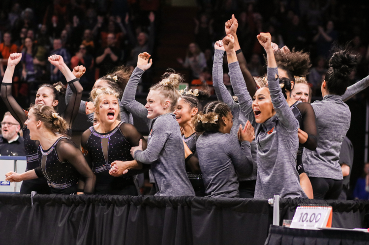 The Oregon State Gymnastics team reacting to their teams performance on the floor at the NCAA Regional Finals at Gill Coliseum on April 6, 2019. The Beavers placed 2nd in Regionals, qualifying them for the NCAA Championship Semifinals, where they ended the season ranked 3rd, causing them to fall short from the Finals. 