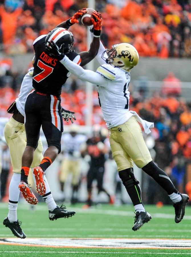 Junior wide receiver Brandin Cooks leaps up for a 42-yard catch at the start of the 2013 season. Cooks finished the game with nine catches for 168 yards and two touchdowns, and added 47 rushing yards.