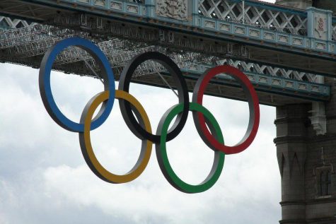 The signature Olympic rings hang in display. 