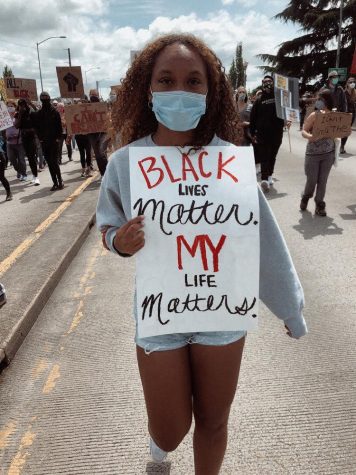 OSU Womens Soccer defender Maddy Ellsworth holds a sign at a Black Lives Matter protest. Ellsworth has been using her platform to raise awareness and call for education in response to George Floyds death. 