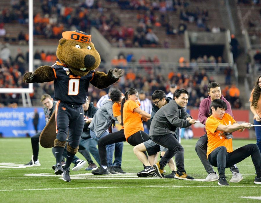 Benny the Beaver encourages students during their tug-of-war battle. 