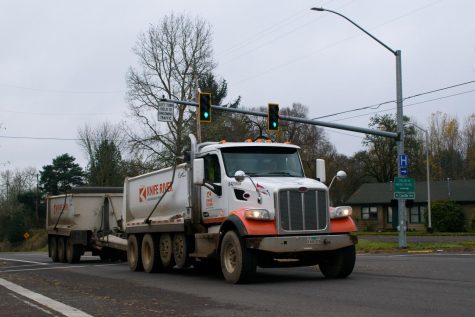 A Truck moves past the intersection of Highway 20 and Northeast Conifer Boulevard. $28 million dollars have been reserved for safety upgrades for Highway 20 in response to the various accidents that have occured on Highway 20 over the years.