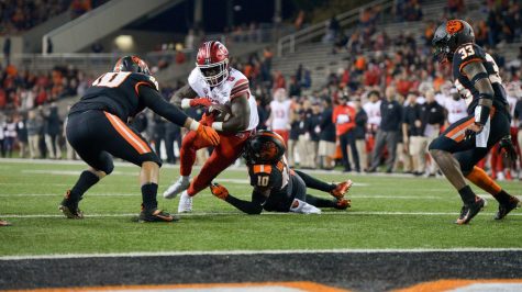 In this file photo from 2019, Utah freshman running back Jordan Wilmore breaks past Oregon State defenders to reach the endzone. After losing to Utah last season, Oregon State will get the chance in 2020 to avenge the loss and improve to 3-2.