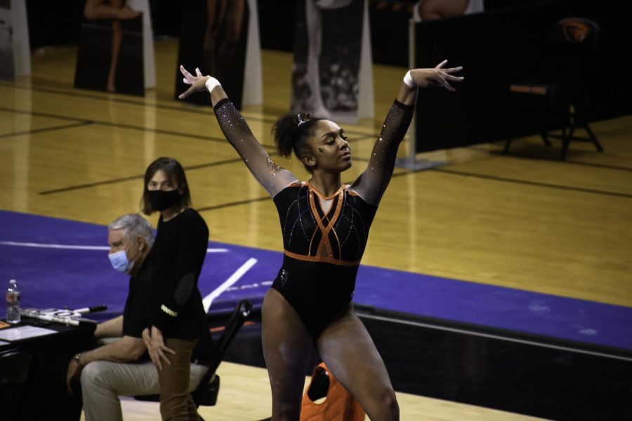 Freshman Ariana Young Greene begins her routine on the balance beam. OSU Women’s gymnastics takes the victory against Washington on January 23rd with a score of 194.925 to 192.875