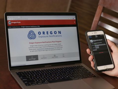 An Oregon State University student learns how to install the Oregon Exposure Notifications Pilot Program on their phone. The program will use people’s Bluetooth to alert them if another user is potentially exposing them to COVID-19.  