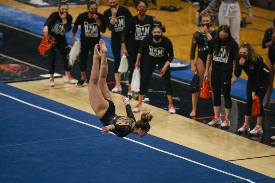 The Oregon State Beavers Gymnastics team cheers on their teammate during a floor routine. OSU Gymnastics faced off against Cal Gymnastics on Sunday, Feb. 21 at Gill Coliseum.