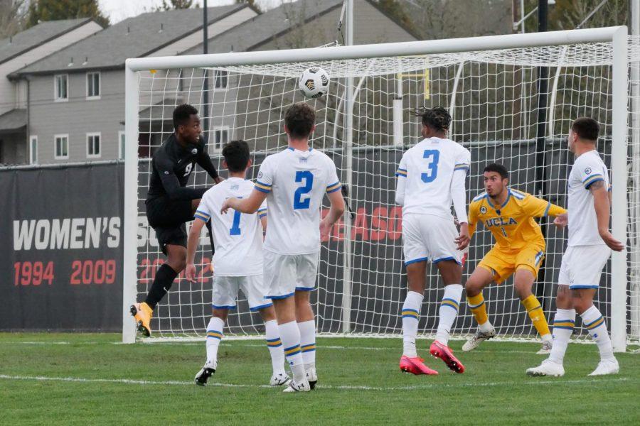 Oregon State junior forward Gloire Amanda attempting to head in in a goal amidst a group of UCLA defenders. Gloire Amanda was awarded College Soccer News Men’s National Player of the week for the week of Feb.14th.