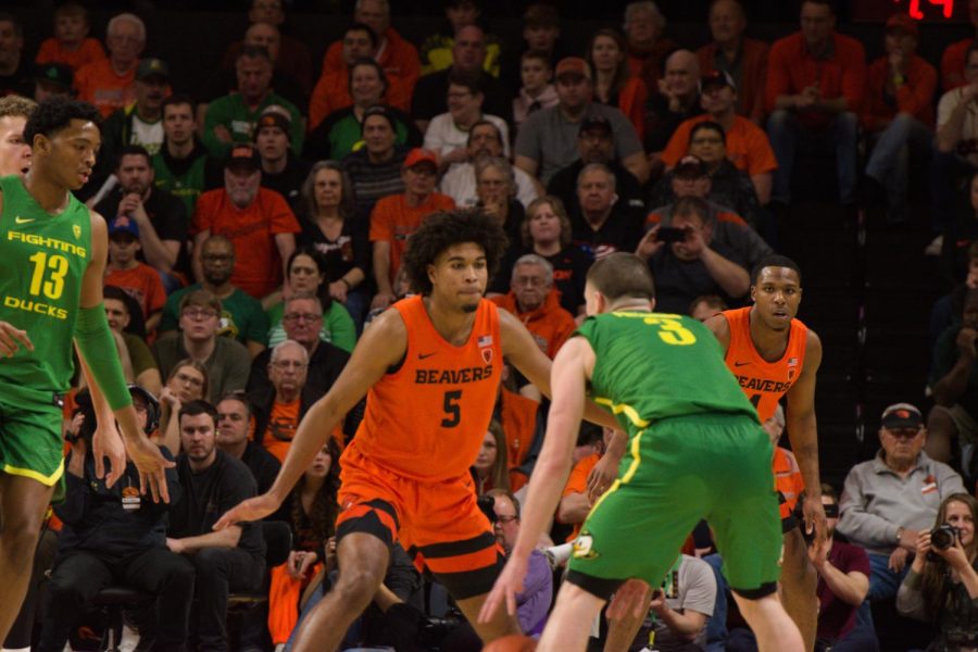 In this file photo from Feb. 27, 2020, OSU guard Ethan Thompson attempts to defend against UO senior guard Payton Pritchard in the Civil War matchup in Gill Coliseum on Feb. 8. Now a senior, Thompson has played in a fair share of rivalry games against the Oregon Ducks.