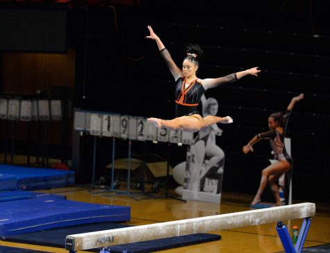 Senior Lexie Gonzalez performs a personal record on the a  beam for senior night on Friday against Utah. Oregon State fell behind Utah by a slim margin of 1.150pts.