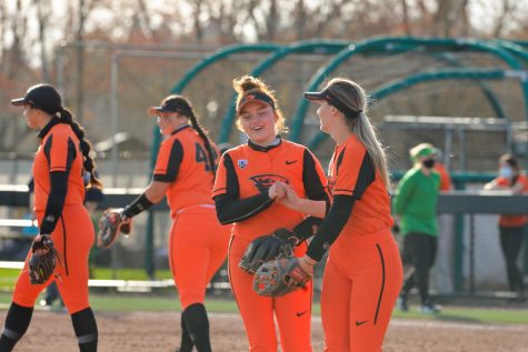 Sophomore shortstop Maya Raider shakes hands with freshman 3rd baseman Grace Messmer before the Ducks were up to bat at the top of the 3rd inning. The Beavers put up a fight against the Ducks but were just edged out by the University of Oregon with a final score of 4-3