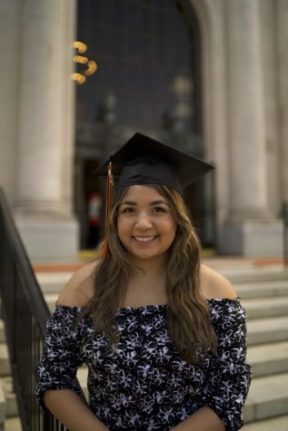 Julia Zavala poses in front of the Memorial Union on the Oregon State University Corvallis, Ore. campus in her graduation cap. Zavala is one of OSU’s first generation college graduates, and has earned an Honors undergraduate degree with a biology major and pre-medicine option. 