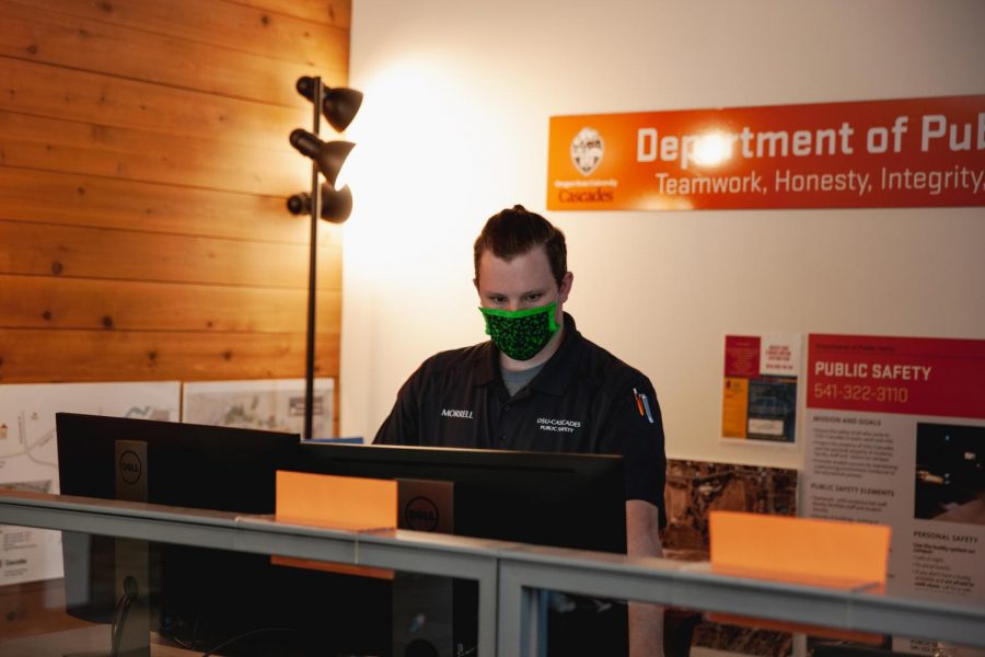 OSU Public Safety Officer, Nic Morrell working during the summer amongst the new mask requirements at the Cascades campus in Bend, Ore. OSU-Cascades follows the main campus in requiring face coverings in all public indoor settings for students and faculty alike.