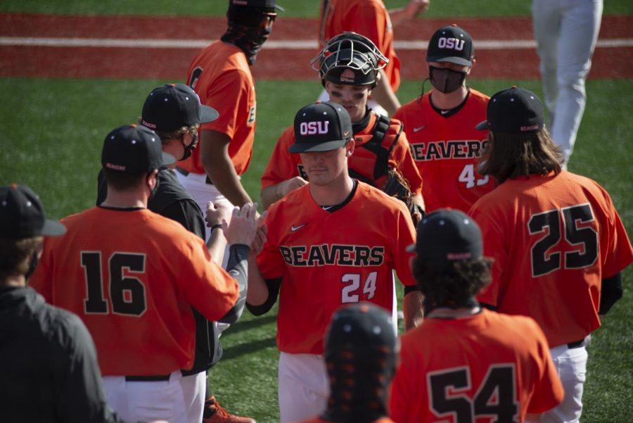 Nathan Burns and the rest of the Oregon State Beavs return to the dugout after a hard inning against University of Oregon Ducks on March 13, 2021. Burns was the 561st overall draft pick and was selected by the Los Angeles Angels.